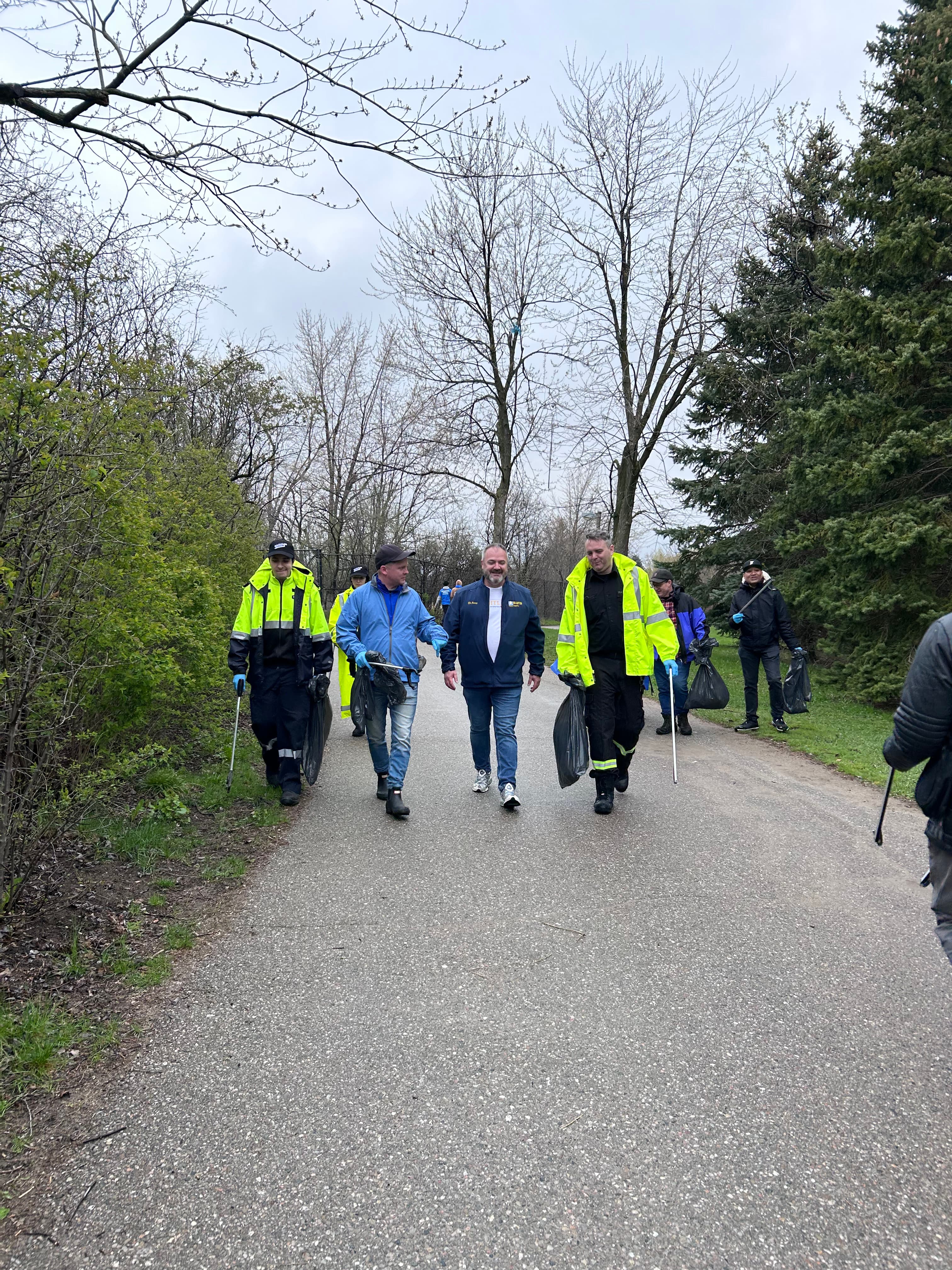Community members gathering at a local Brampton park improvement event